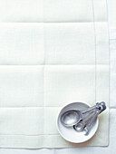 Set of measurement spoons on linen tablecloth