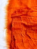 Orange tie-dyed fabric