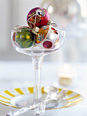 Three baubles in cocktail glass