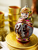 Russian doll bauble on gold coins