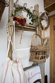 Ladder and brushes with Christmas greenery in Tenterden home, Kent, England, UK