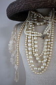 Pearl necklaces and hat on dressmakers dummy in Tenterden home, Kent, England, UK