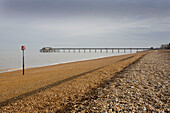The pier at Deal seafront with shingle beach Kent England UK