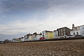 Promenade of houses on Deal seafront with shingle beach Kent England UK