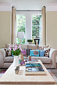 Books on coffee table with sofa in Staplehurst living room Kent England UK