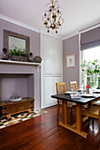 Table and chairs in lilac dining room of Staplehurst home Kent England UK