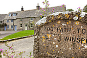Directional footpath on boundary stone in Worth Matravers Dorset England UK