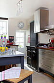 Black range oven with stainless steel fitted units in Old Town kitchen Portsmouth England UK