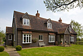 Woodclad exterior of Kent home with dormer windows England UK