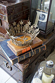 Silver crown and hardbacked books with vintage case and letter P in Victorian villa Kent England UK