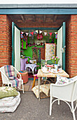 Table and chairs in backyard of teashop Brighton Sussex England UK