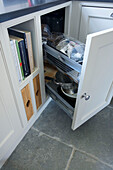 Recipe books and sliding drawer in fitted Woodchurch kitchen Kent England UK
