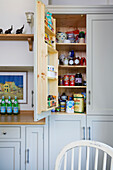 Open pantry door in kitchen detail of Woodchurch home Kent England UK