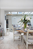 Winter lilies in open plan dining room extension London UK