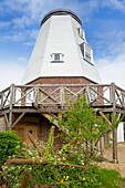 Grade ll listed windmill conversion with staging balcony for adjustment of sails Kent UK