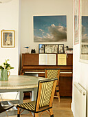 Artwork canvas above piano in dining room of London home England UK