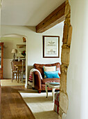 View from living room through open arch in modernised Oxfordshire cottage, England, UK