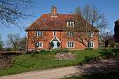 Brick exterior of detached Kent country cottage, England, UK