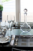 Place setting with decanter and wine glasses in Newmarket home Suffolk UK