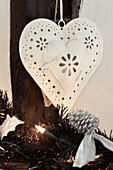 Carved heart shaped Christmas decoration in Sussex home UK