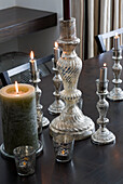 Silver candlesticks on dining table London UK