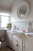 Panelled wash basin at window of Sussex home UK