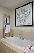 Large artwork over bath in classic Tyne & Wear home, England, UK