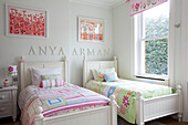 Twin beds in child's room of contemporary London family home, UK