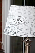 Close up of world map lampshade in Kent cottage, England, UK