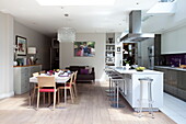 Open plan kitchen and dining room in contemporary London townhouse, England, UK