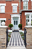 Original entrance path to front door of red brick London home, UK