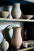 Assortment of vases and bowls on shelves in London home England UK