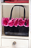 Black and pink floral handbag in Sussex country house, England, UK