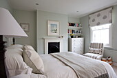 Classic bedroom with recessed storage in London townhouse, England, UK
