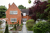 Stepping stone path and brick exterior of Dulwich home, London, England, UK