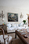 White sofa and artwork with wooden coffee table in Mougins apartment, Alpes-Maritime, South of France