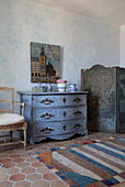Blue painted chest of drawers with folding screen in Mougins bedroom, Alpes-Maritime, South of France