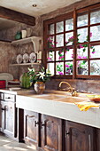 Cut lilies on double sink of French holiday villa