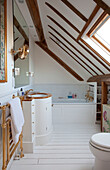 White bathroom with beamed ceiling in Chilterns home, England, UK