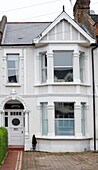 London townhouse, facade with frosted glass bay window, England, UK