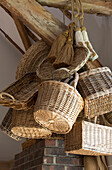 Assortment of baskets in timber framed farmhouse kitchen, UK