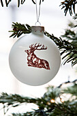 Reindeer bauble on Christmas tree in London home, England, UK