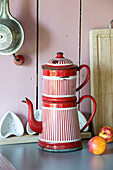 Red and white striped coffee maker on kitchen counter in Brittany cottage, France