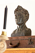 Bust on brown suitcase in Twickenham townhouse, Middlesex, England, UK