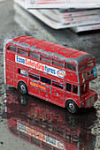 Red London bus on tabletop in London home England UK