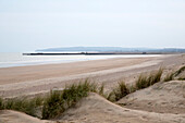 Windswept sand dunes on Camber Sands East Sussex England UK