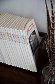 Collection of paperback books with feathers in Presteigne cottage Wales UK