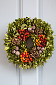 Christmas wreath on front door of Dronfield home  Derbyshire  England  UK