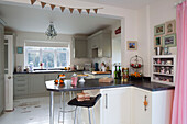 Stool at breakfast bar in open plan kitchen of Laughton home  Sheffield  UK