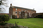 Lawned exterior of Georgian farmhouse King's Lynn  Norfolk  England  UK